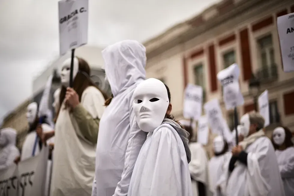 Photo of Members of 'Compana Feminista' during a protest against the recent seven sexist murders (five women and two girls) in just one week in Puerta del Sol, Spain.