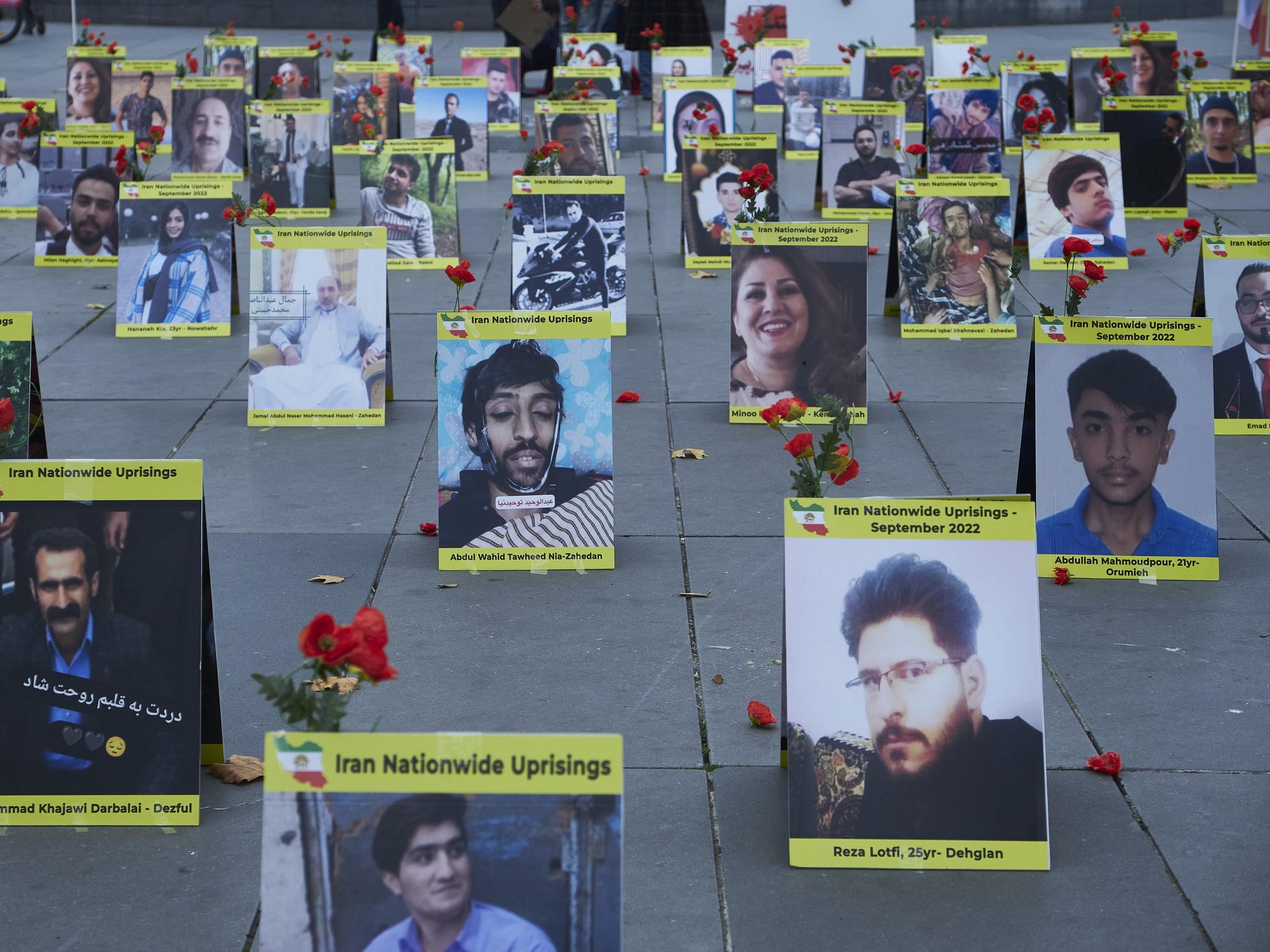 Photo of men and women killed during protests in Iran laid out in Paris