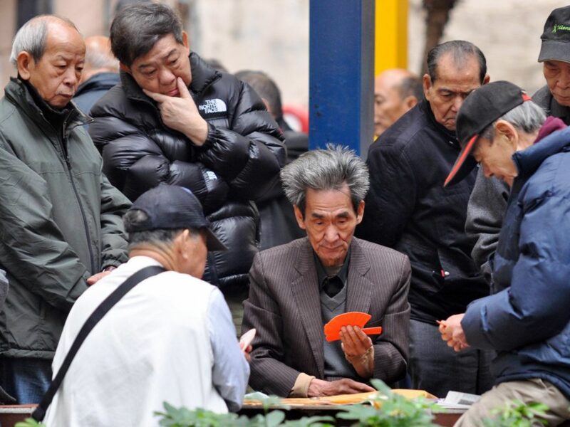 photo of men playing Mahjong