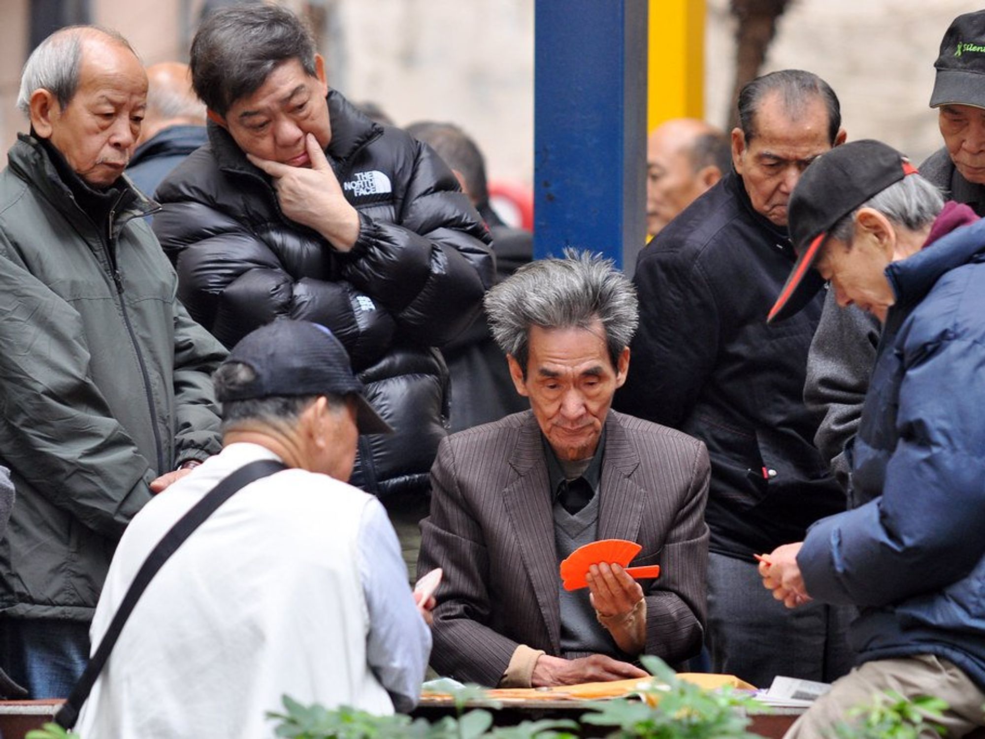 photo of men playing Mahjong