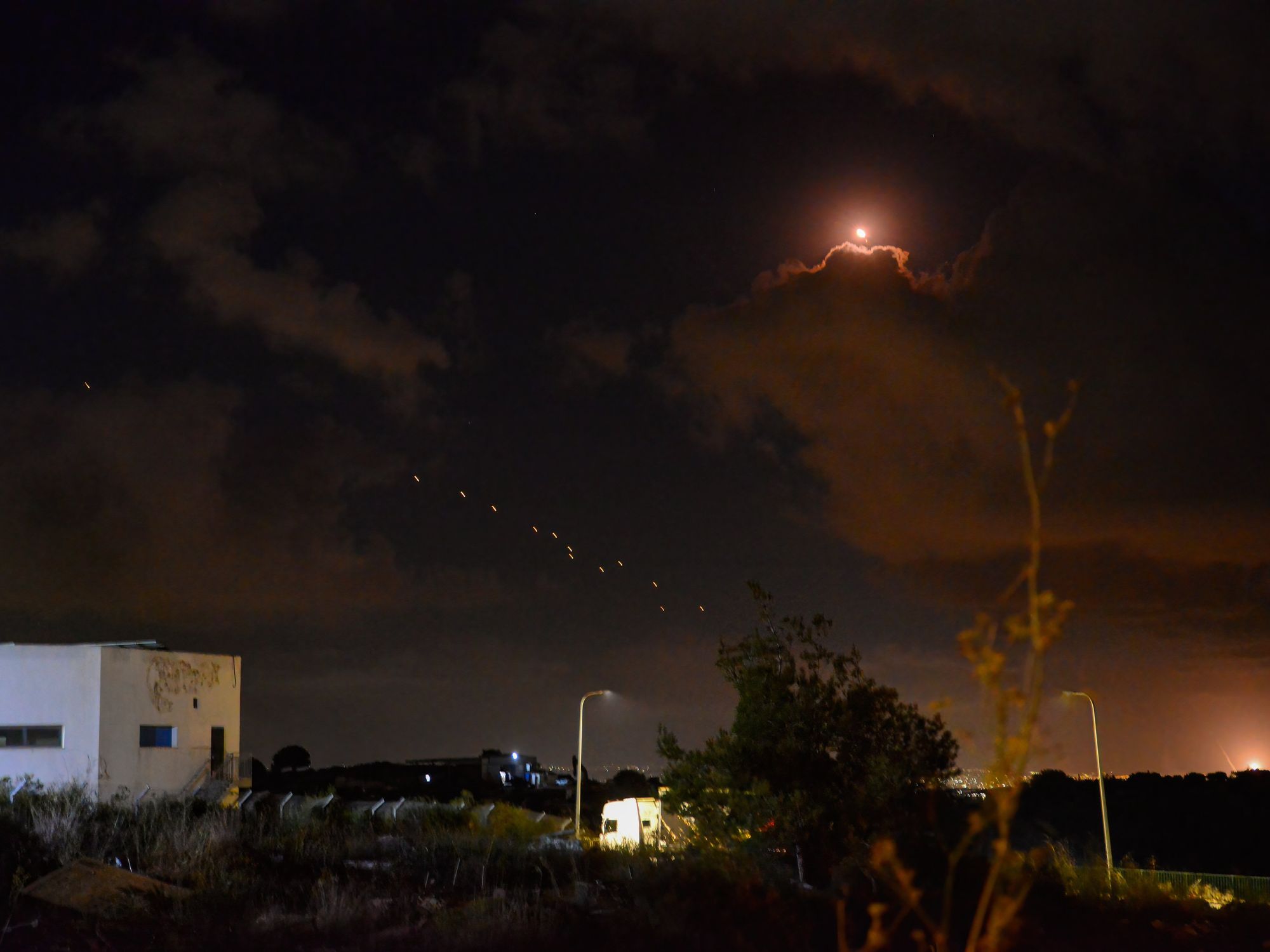 photo of missiles in night sky