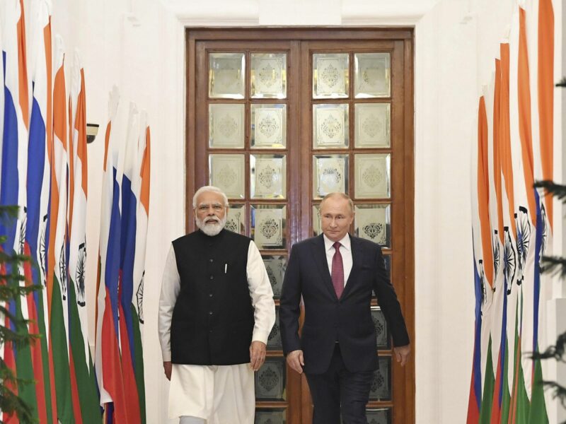 Photo of Modi and Putin walking toward camera