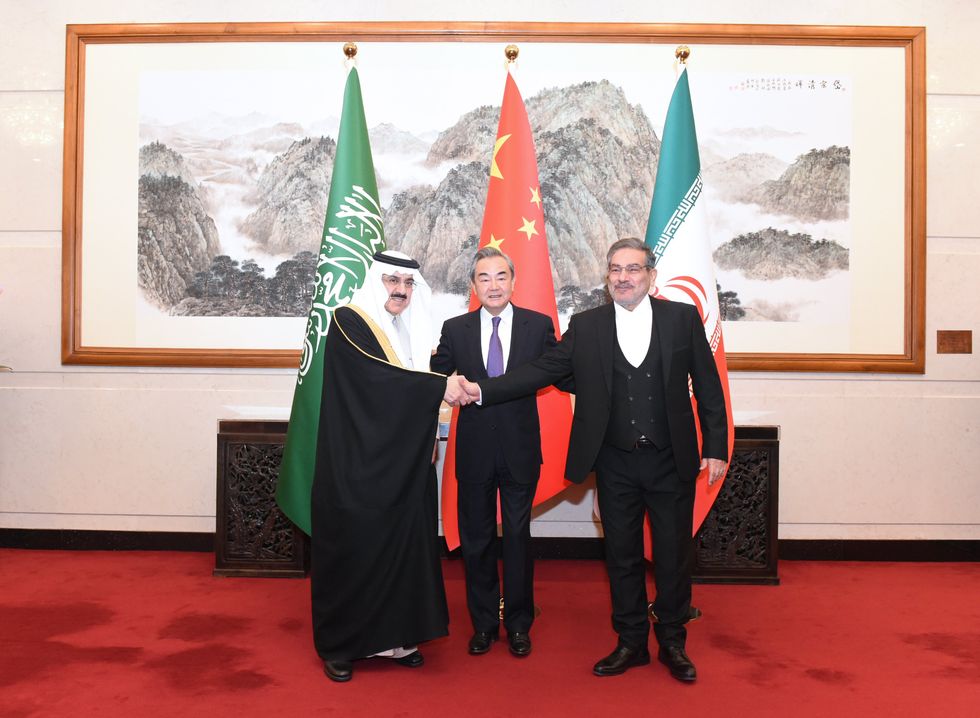 Photo of Musaad bin Mohammed Al-Aiban (L), Saudi Arabia's Minister of State, Wang Yi (C), director of the Office of the Foreign Affairs Commission of the CPC Central Committee and Admiral Ali Shamkhani (R), Secretary of the Supreme National Security Council of Iran, in Beijing on March 10, 2023.