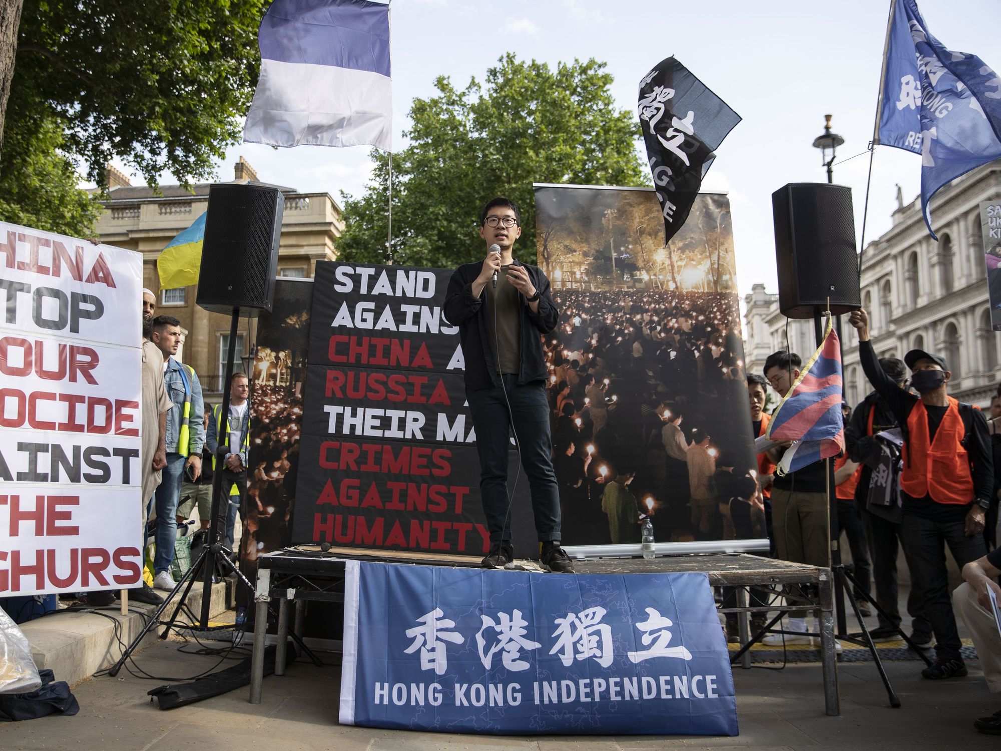 Photo of Nathan Law, an activist in exile and former member of the Legislative Council in Hong Kong speaks during a rally.