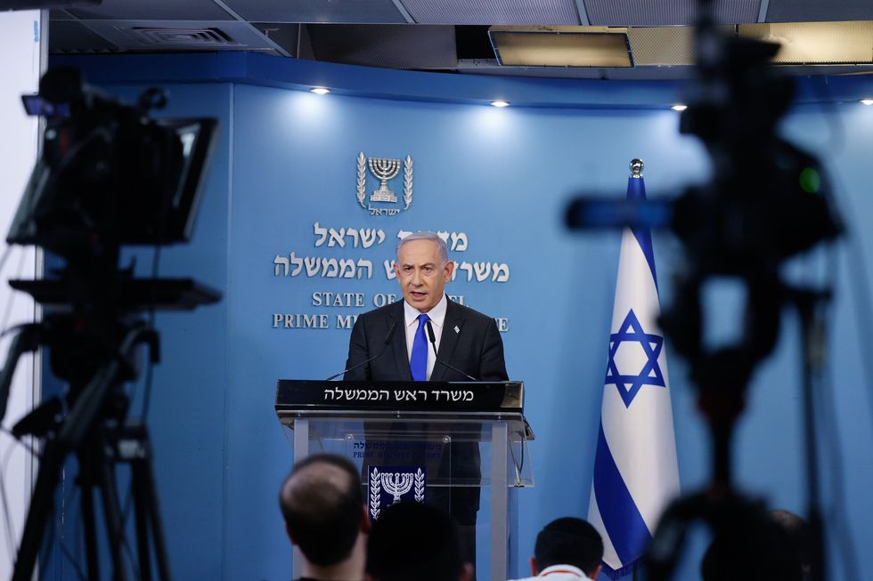 photo of netanyahu speaking at a podium