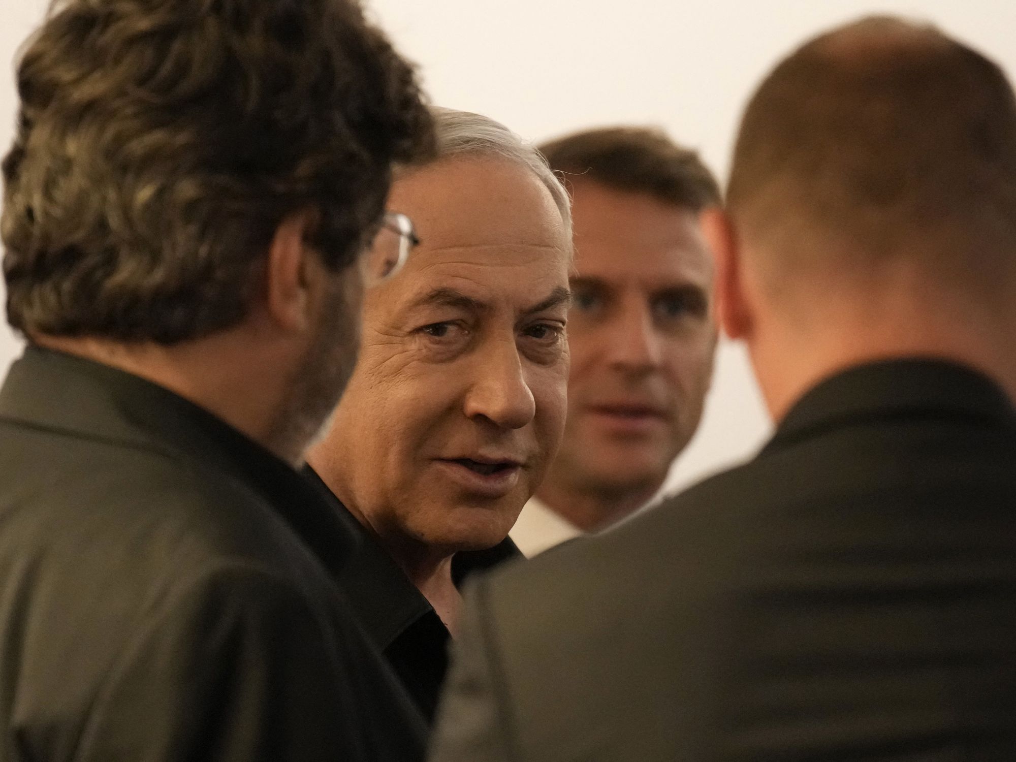 photo of netanyahu with macron in background