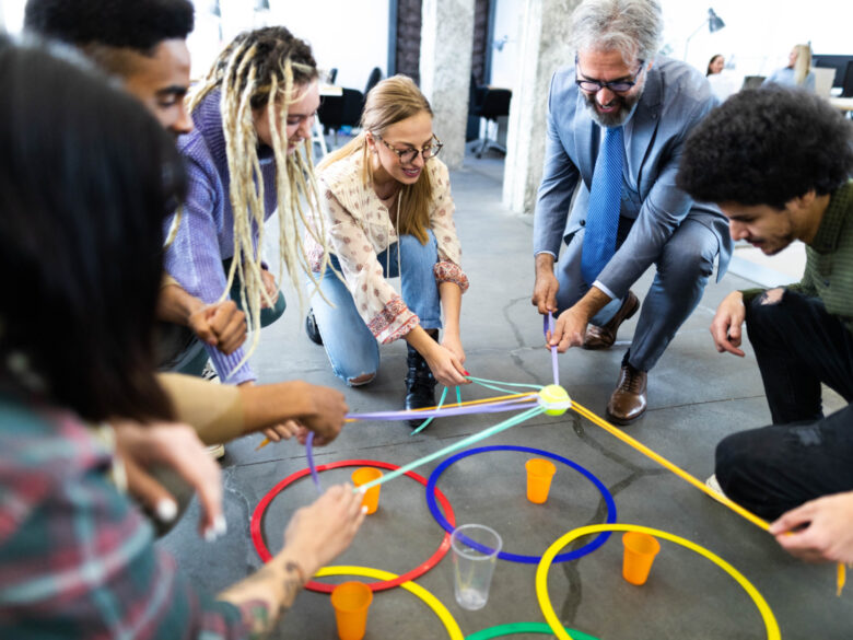 Photo of office workers participating in a team building exercice