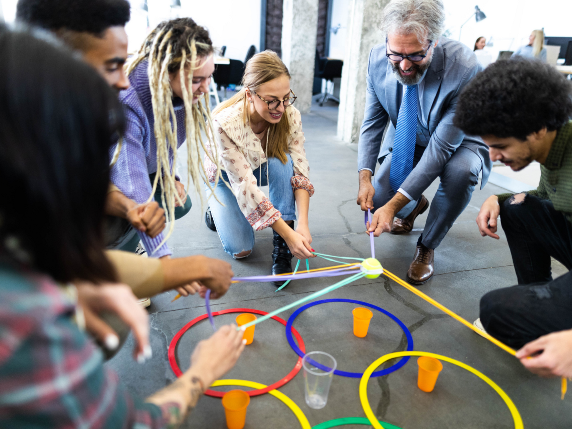 Photo of office workers participating in a team building exercice