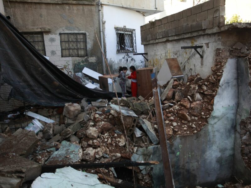 Photo of Palestinian children among the rubble in Jenin