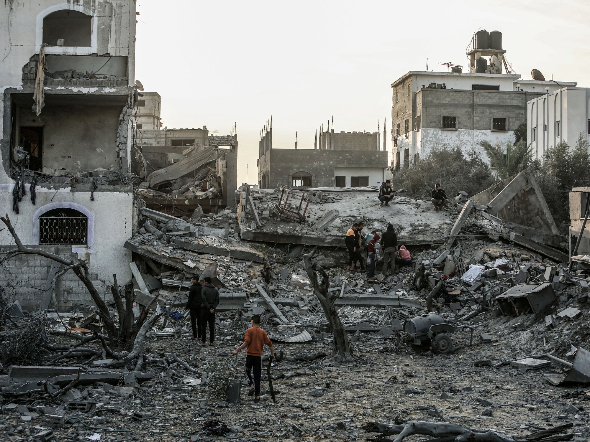 Photo of Palestinians among rubble in Gaza