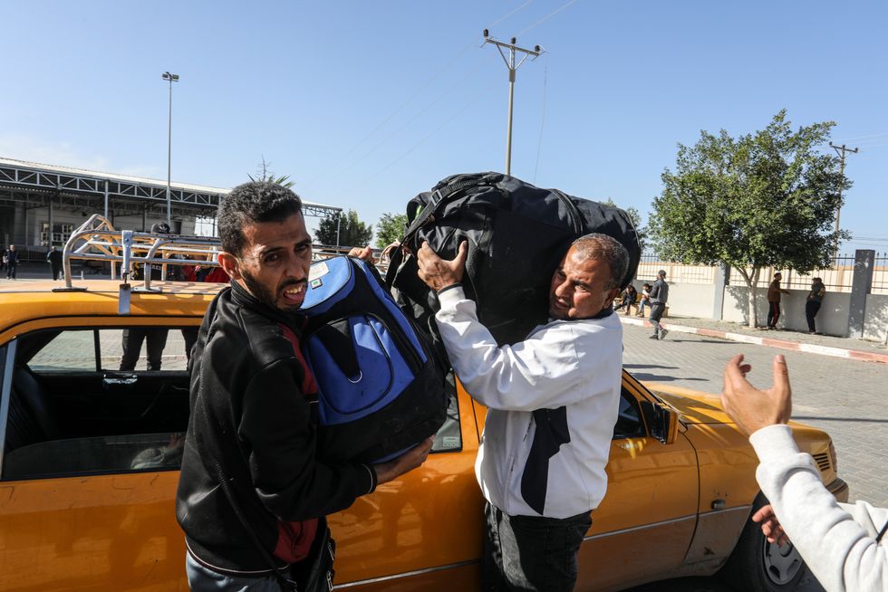 Photo of Palestinians greeting each other in Gaza during the four-day truce
