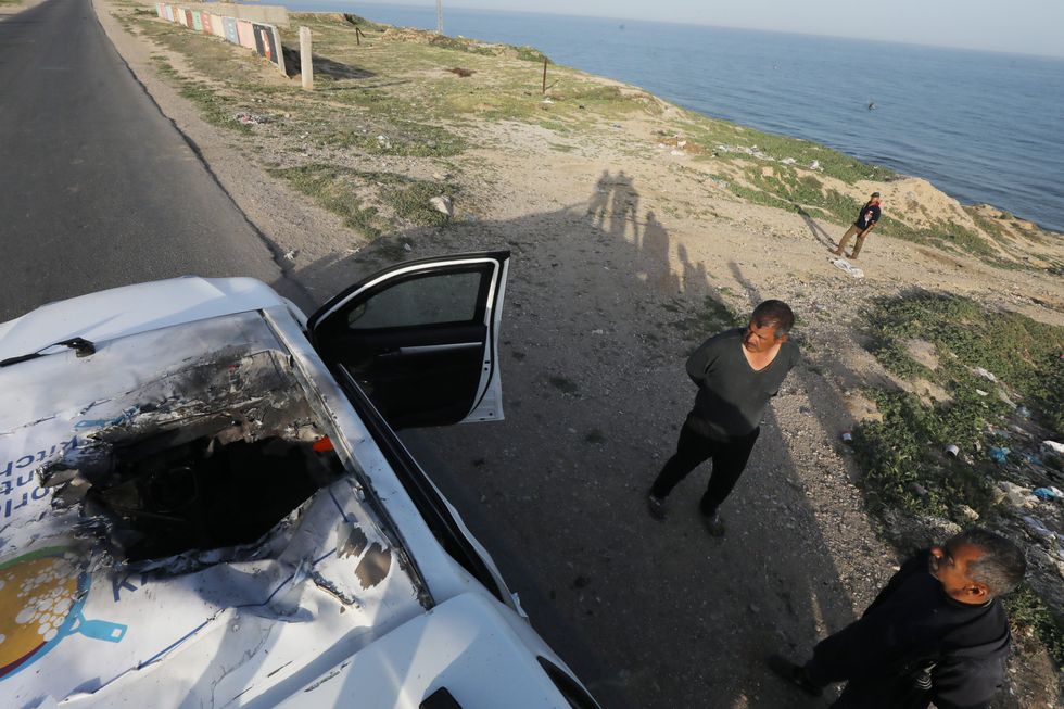 Photo of Palestinians inspecting the damage on the World Central Kitchen (WCK) vehicle targeted by an Israel strike in Gaza.
