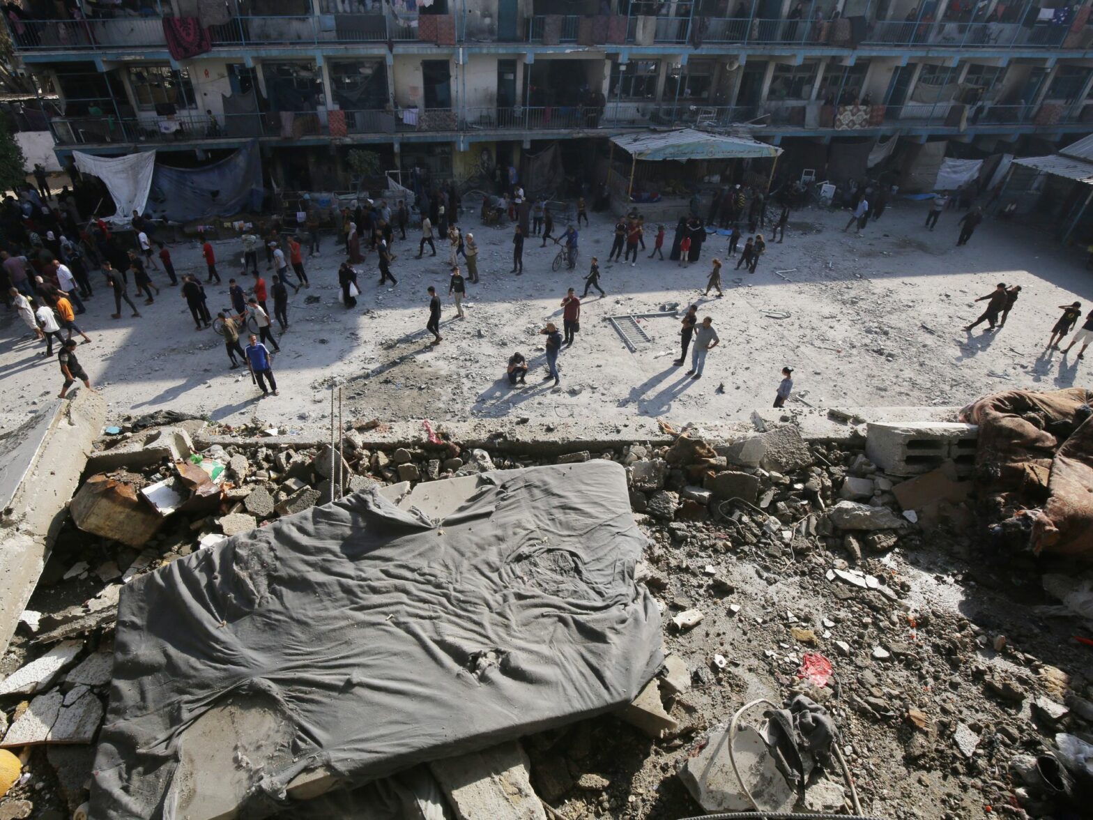 Photo of Palestinians inspecting the damaged school following an Israeli airstrike on a school for displaced persons belonging to the United Nations Relief and Works Agency for Palestine Refugees in the Near East (UNRWA) in Nuseirat refugee camp on June 06, 2024 in Gaza Strip (Credit Image: © Omar Ashtawy/APA Images via ZUMA Press Wire)