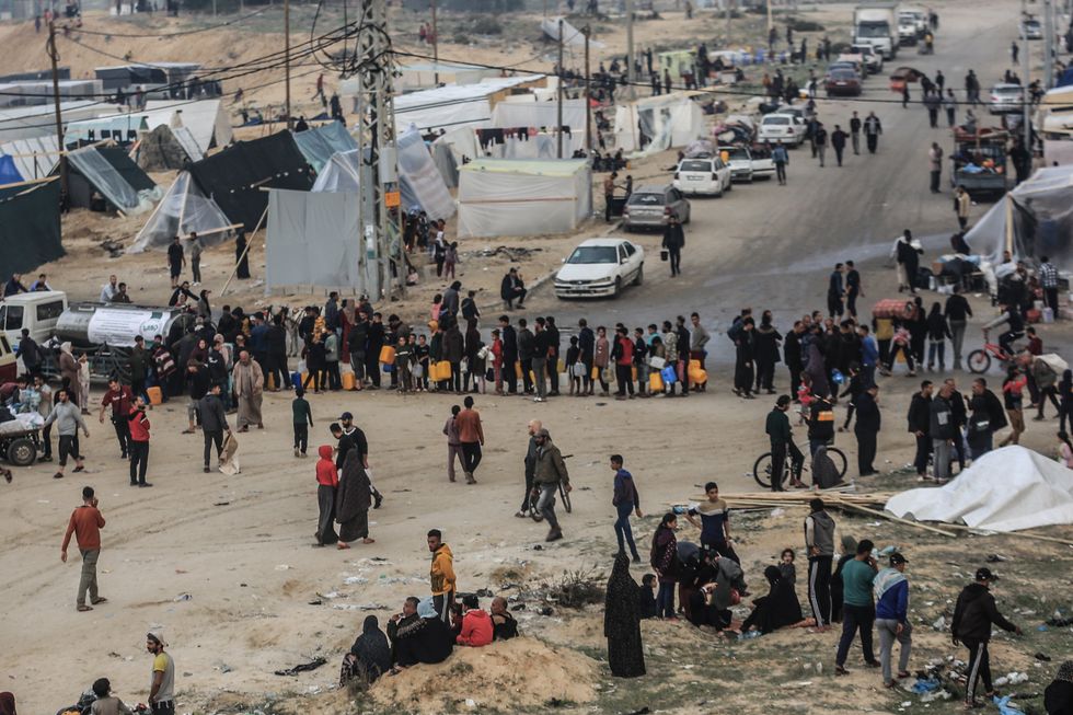 Photo of Palestinians setting up tents near the Egyptian border.