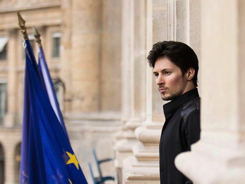 Photo of Pavel Durov standing in front of European flags