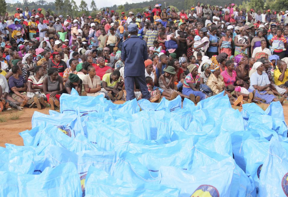 Photo of people and blue bags after Cyclone Idai struck in Chimanimani, Manicaland Province, Zimbabwe, March 22, 2019.​