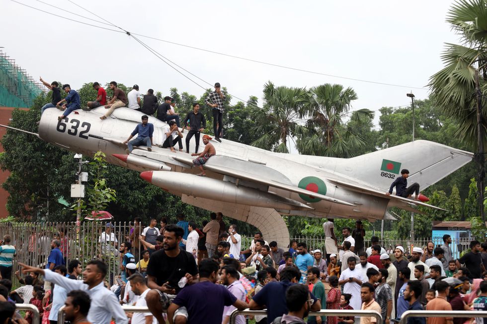 Photo of people celebrating Sheikh Hasina, the longest-serving prime minister in Bangladesh's history, resigned and fled the country.