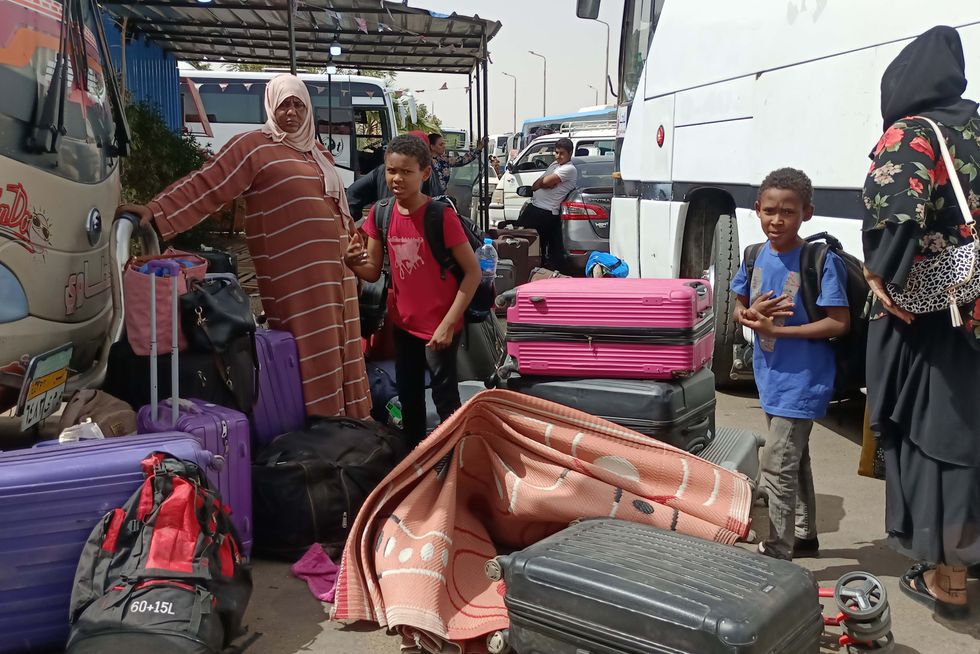 Photo of people fleeing from Sudan are seen at a bus station in Egypt