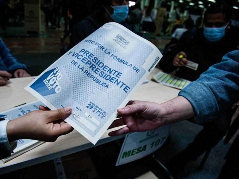 Photo of people holding a presidential election ballot in Bogota, Colombia