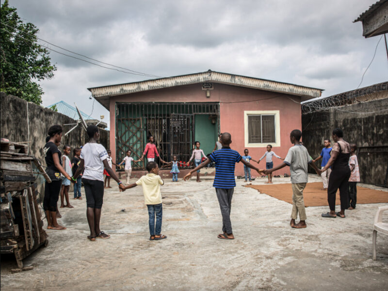 photo of people in a circle holding hands