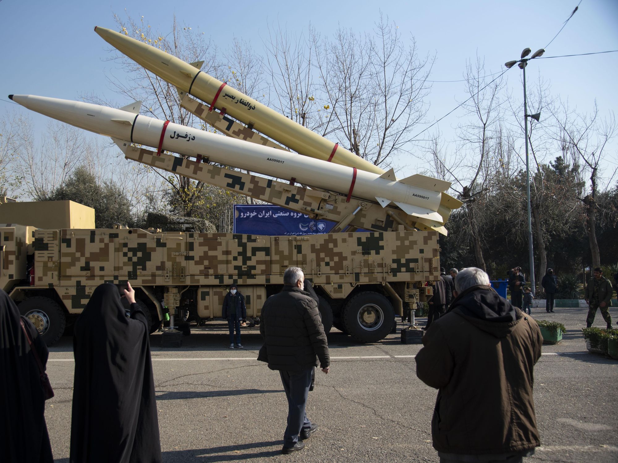 Photo of people in front of missiles in the streets of Tehran as part of a ​military parade by the paramilitary Revolutionary Guards in Tehran on Jan. 7