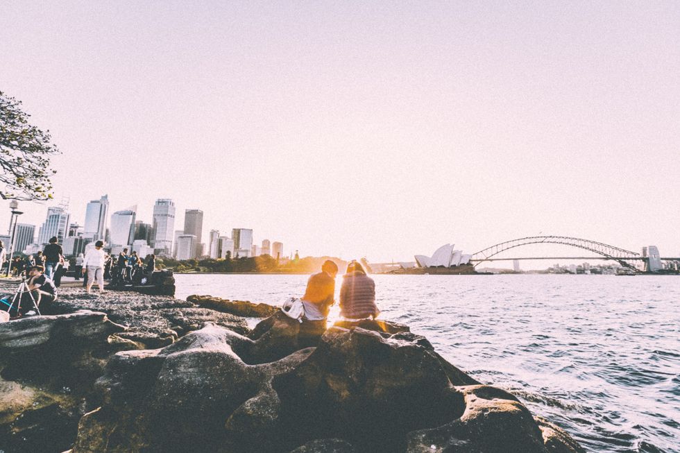 Photo of people in front of the Sydney Opera House