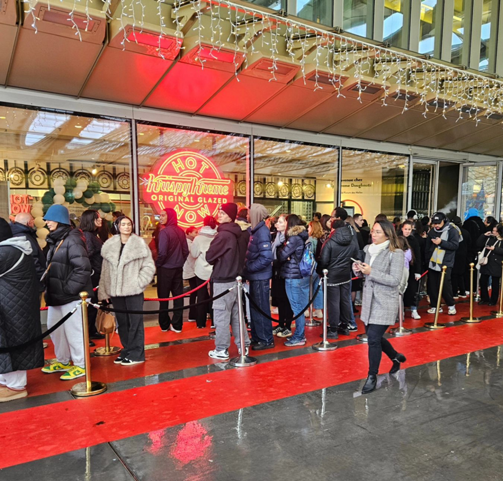 Photo of people in line for the opening of the first Krispy Kreme in Parris, France.