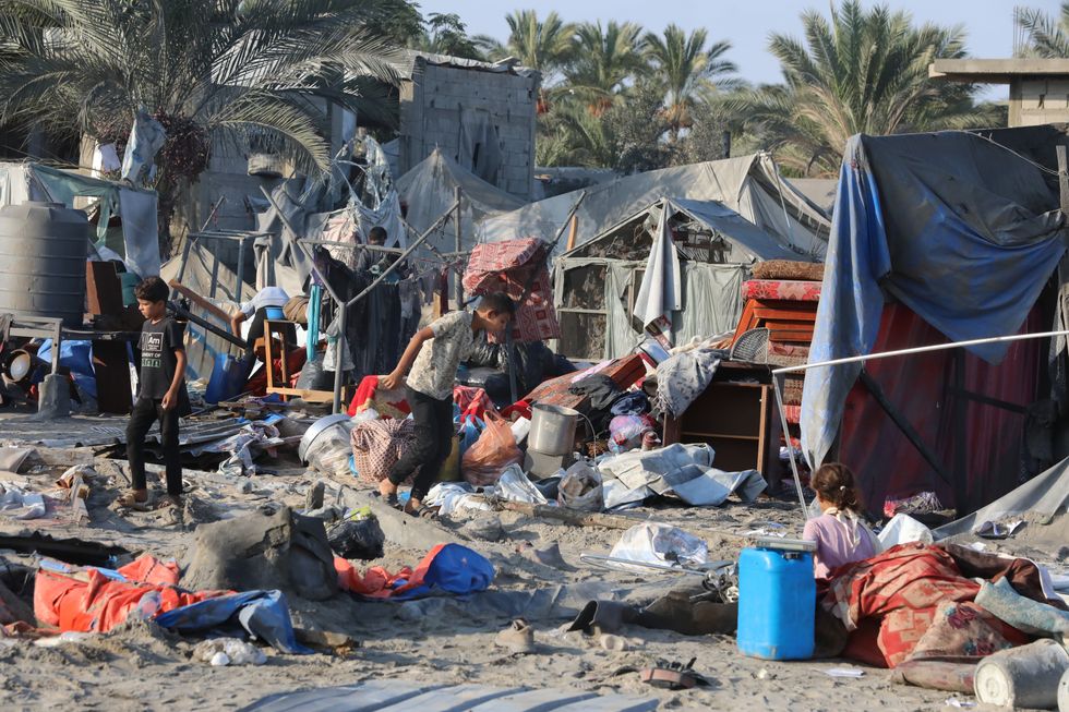 Photo of people inside a makeshift camp Khan Younis, Gaza, after an Israeli airstrike.