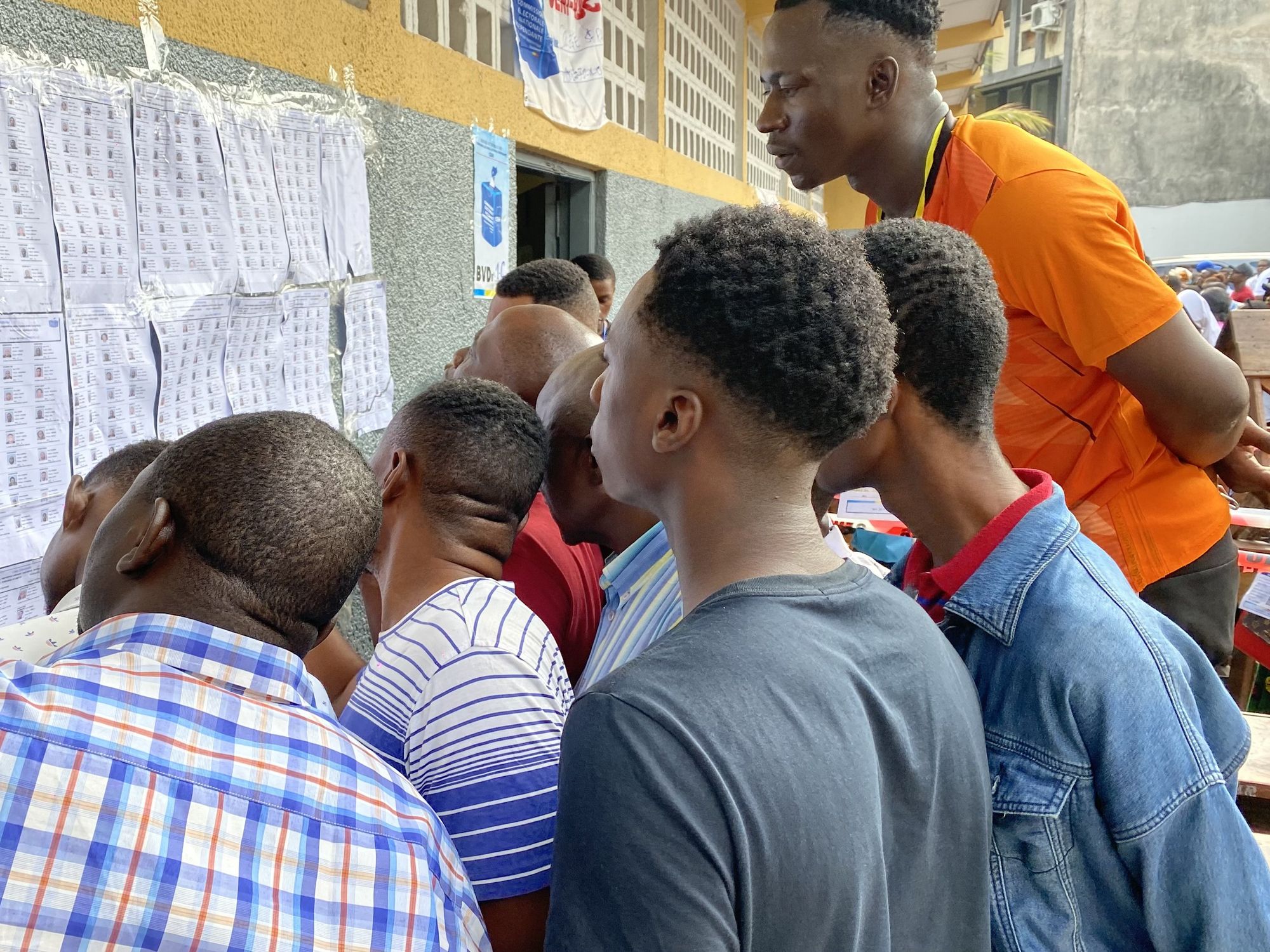photo of people looking at electoral lists