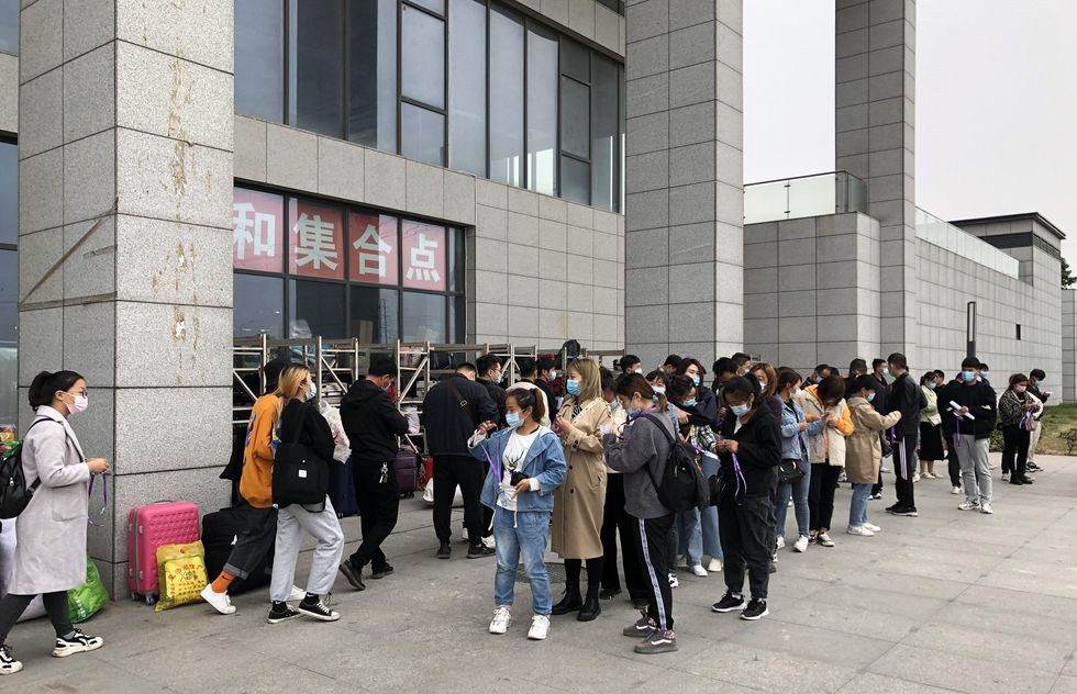 Photo of people outside a Foxconn factory