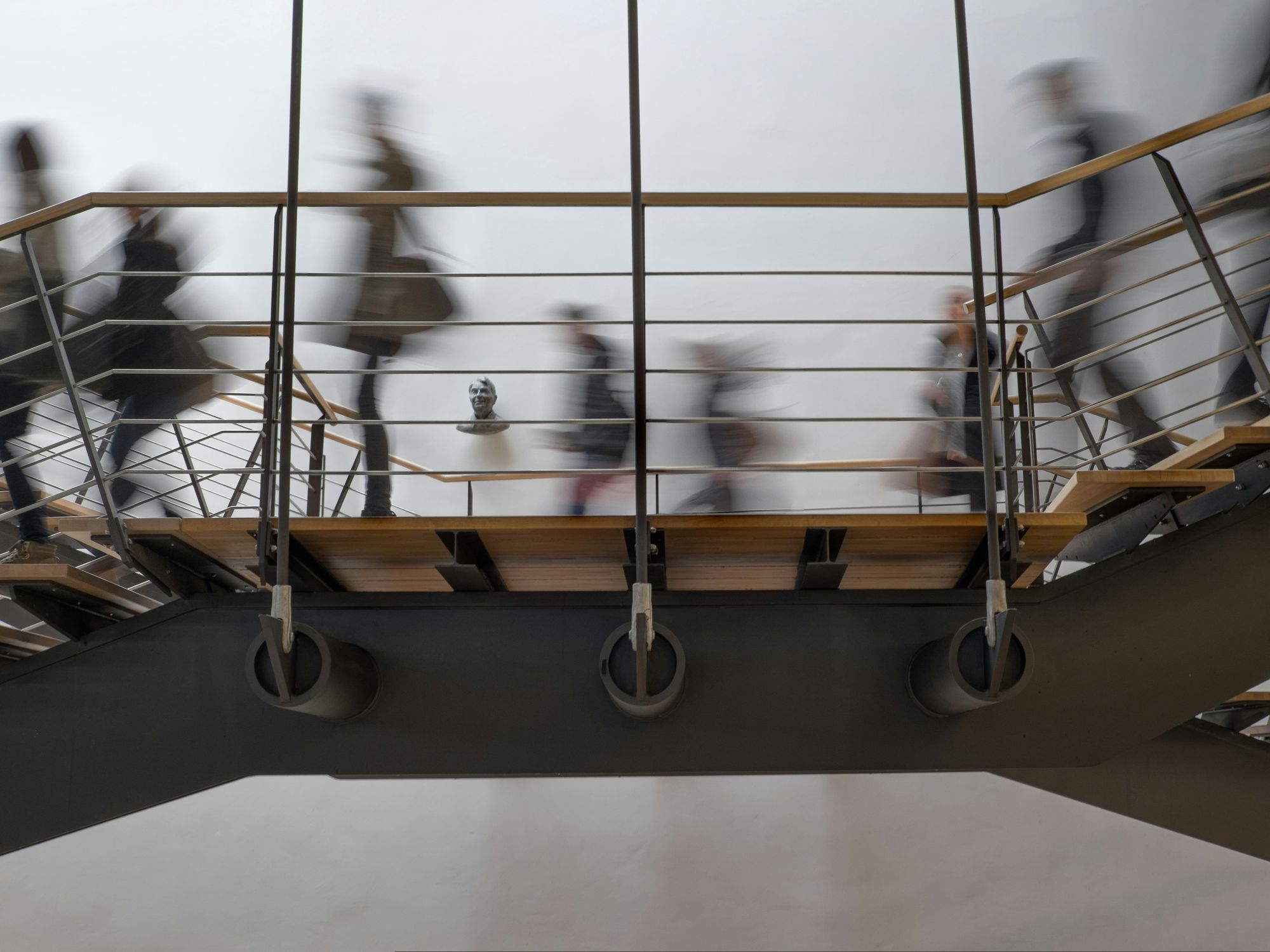 Photo of people passing by on a bridge in Stuttgart Germany