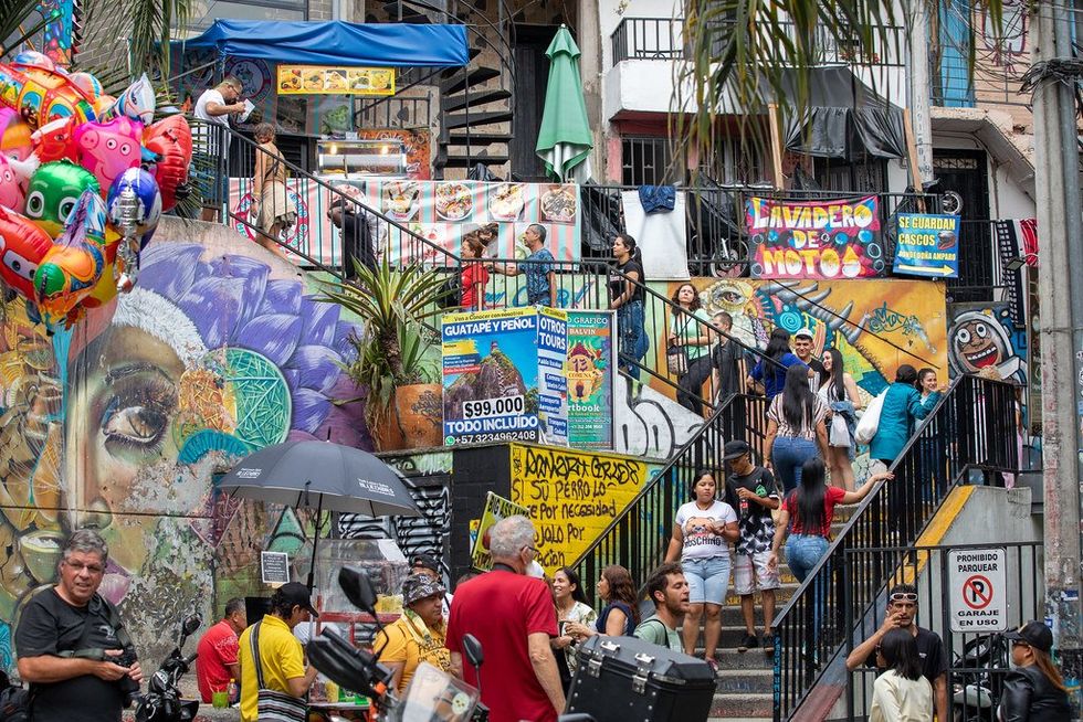 Photo of people walking in a touristic part of Medellín, Colombia