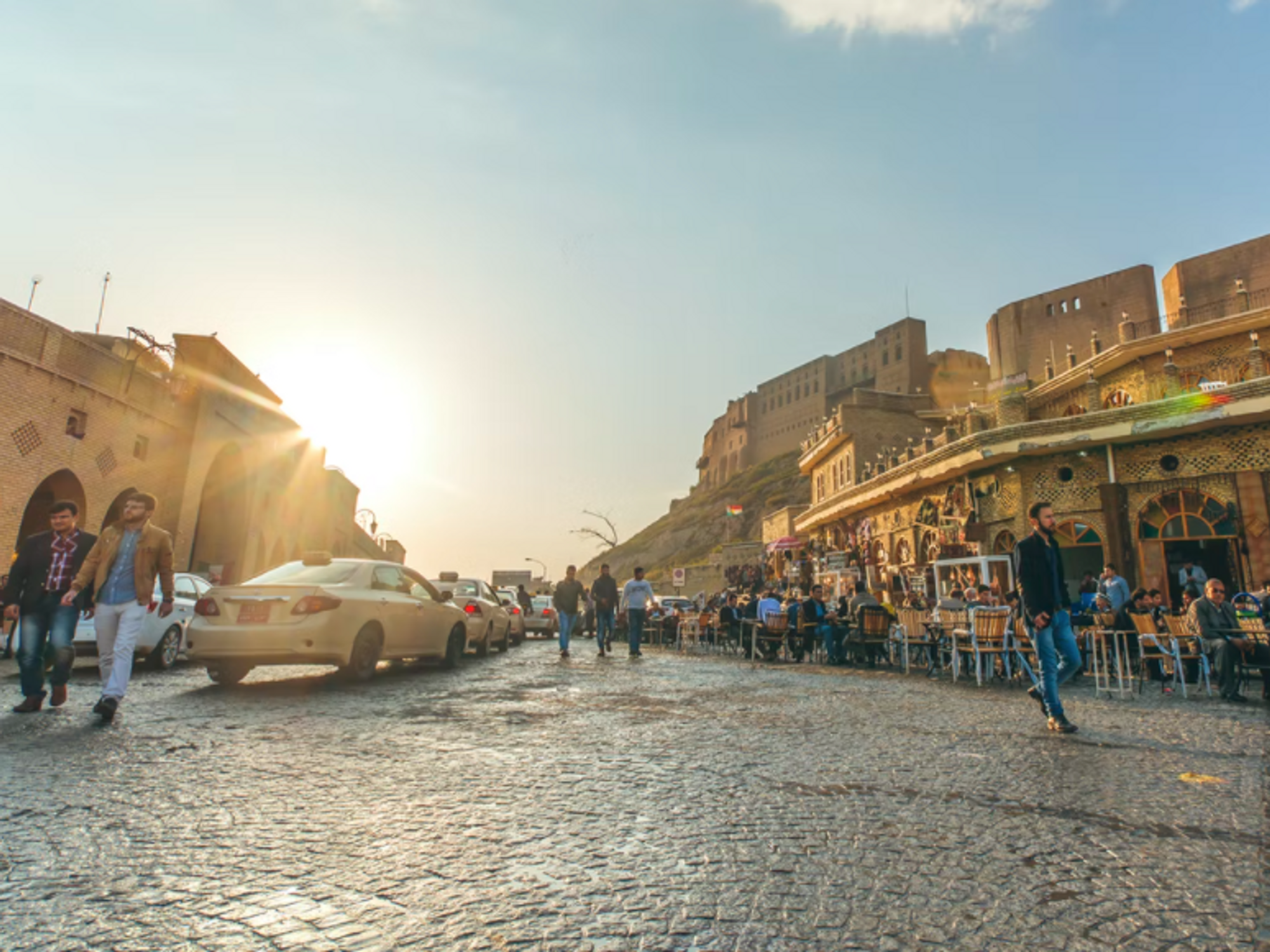 Photo of people walking in the street or sat at cafe tables in Erbil, Iraq