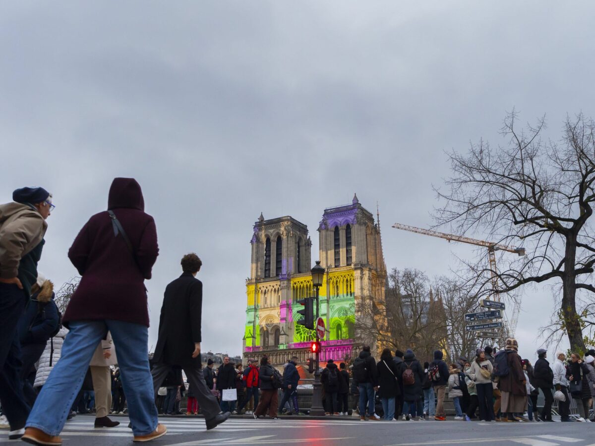 photo of people walking toward notre dame