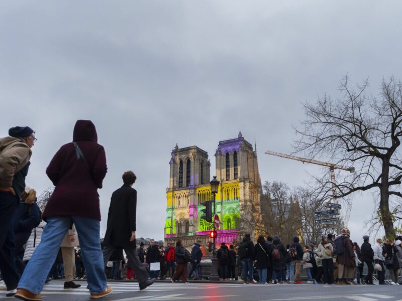 photo of people walking toward notre dame