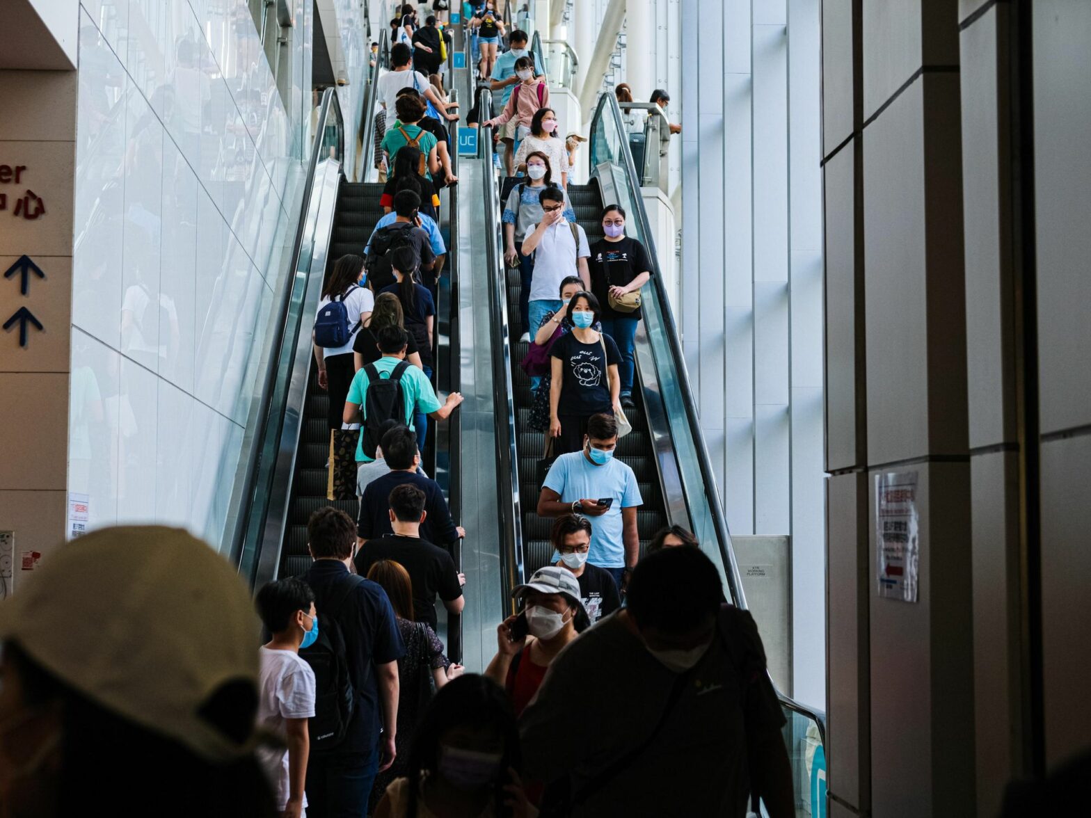 Photo of people wearing masks in a Hong Kong mall