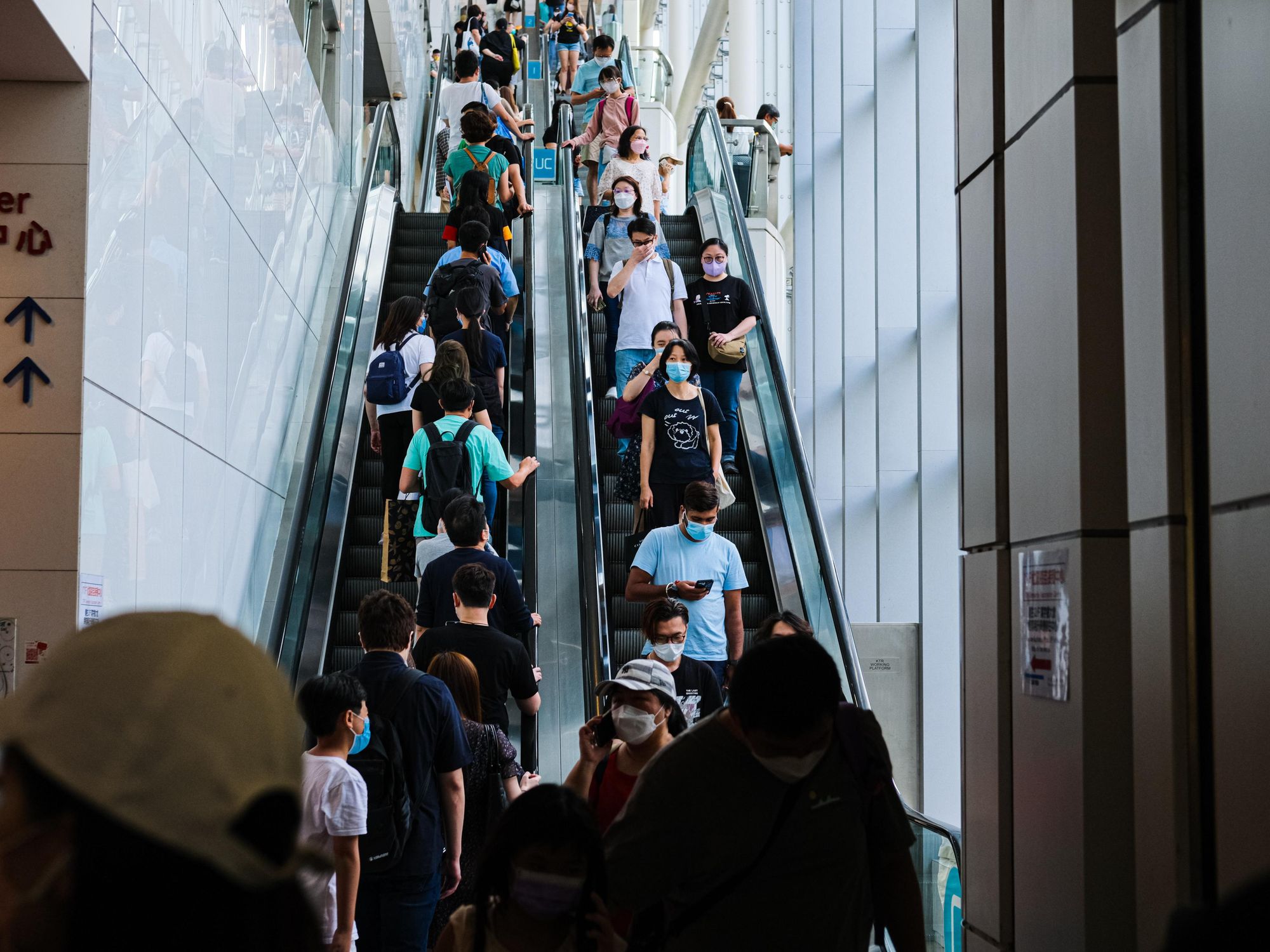 Photo of people wearing masks in a Hong Kong mall