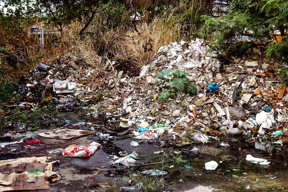 Photo of piles of garbage in nature
