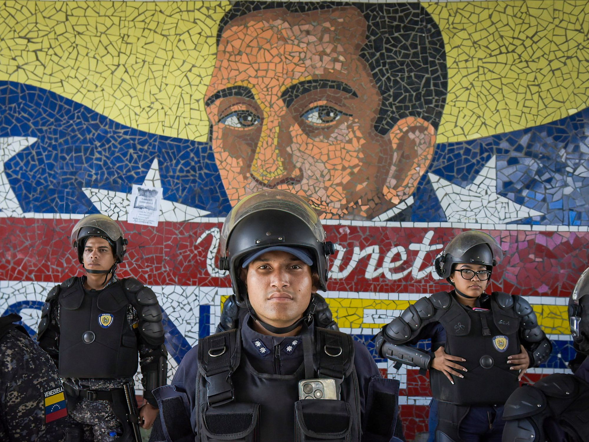 photo of police in front of mural