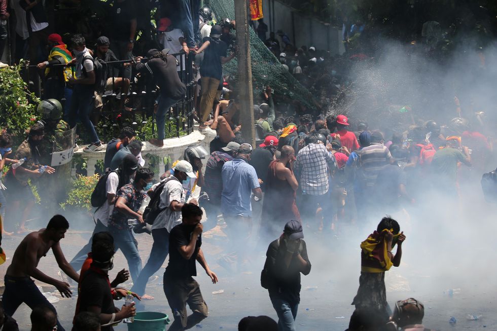 Photo of police using tear gas on protesters in Sri Lanka