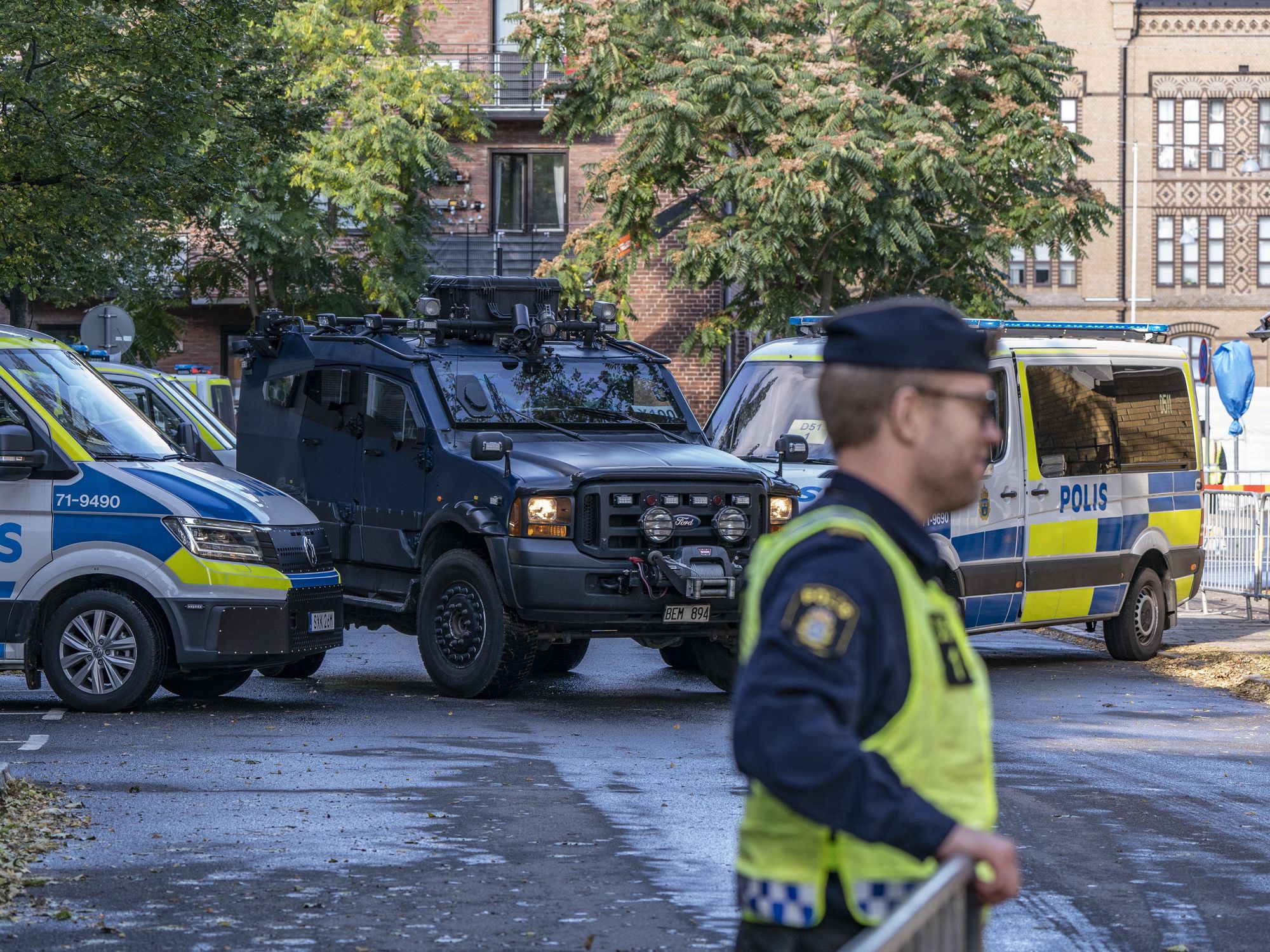 Photo of policy cars and security personnel outside Malmö's synagogue before a visit by Swedish Prime Minister Stefan Lofven for the Malmö International Forum on Holocaust Remembrance and Combating Antisemitism, on Oct. 12, 2021