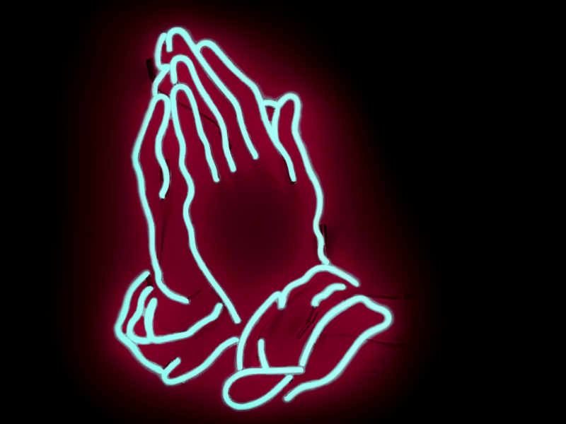 Photo of praying hands in neon sign