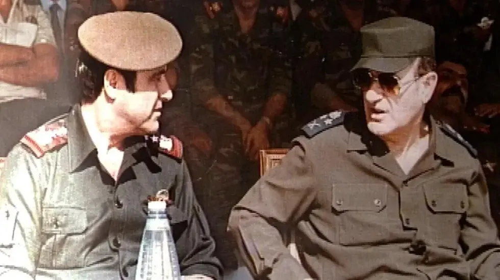 Photo of President Hafez al-Assad (right), his brother, Major General Rifaat al-Assad (left) at a military ceremony in Damascus, 1984.