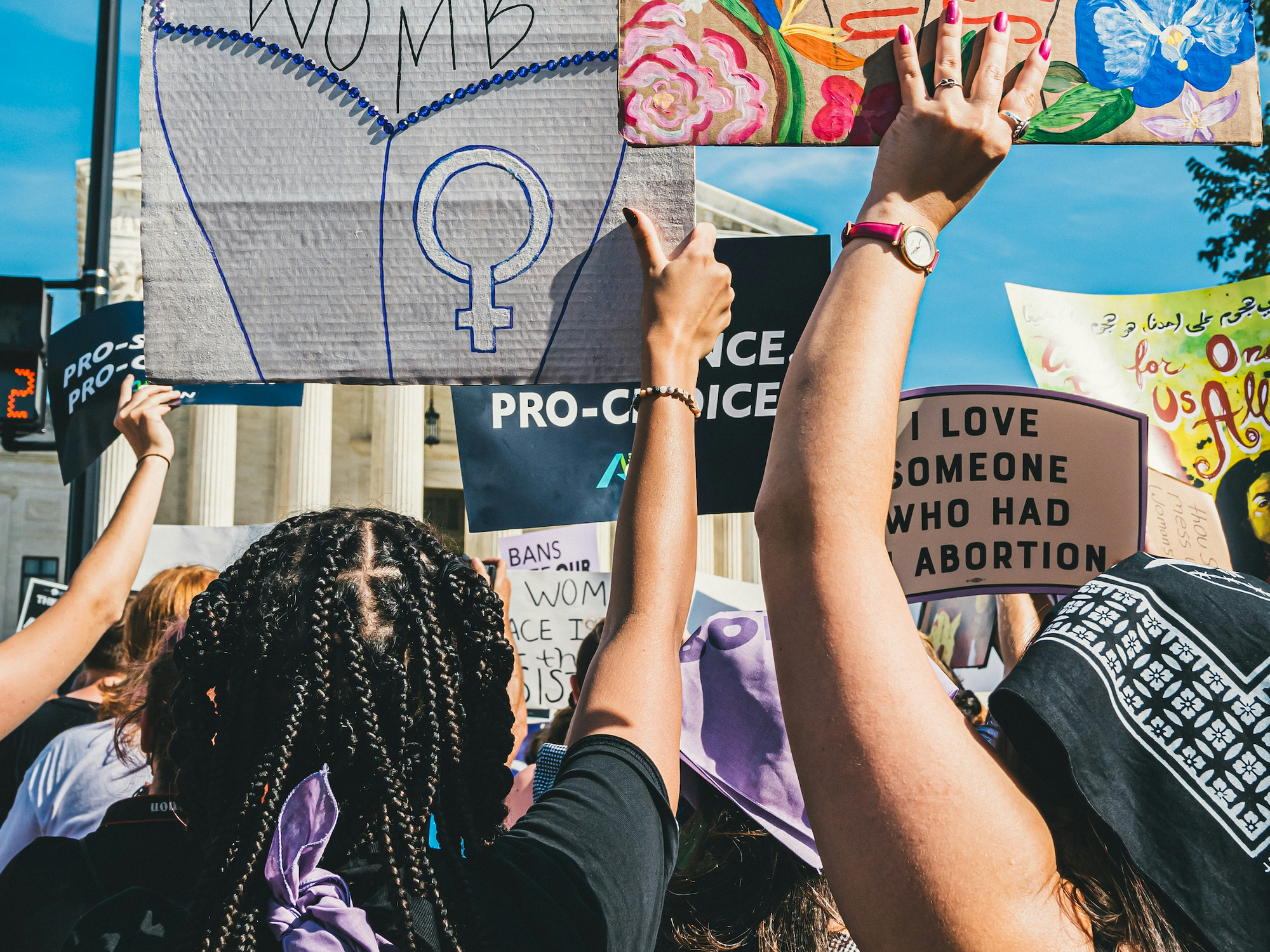 Photo of pro-choice female protesters holding signs as part of a demonstration in Washington, D.C.