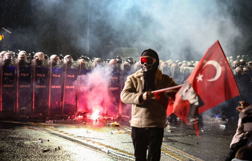 Photo of protesters clashing with police forces in Istanbul on March 23 .