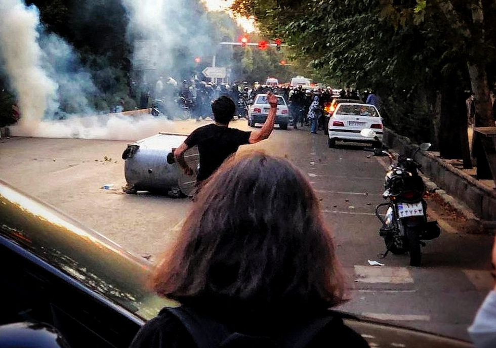 Photo of protesters clashing with police forces in Tehran in the wake of Mahsa Amini's murder