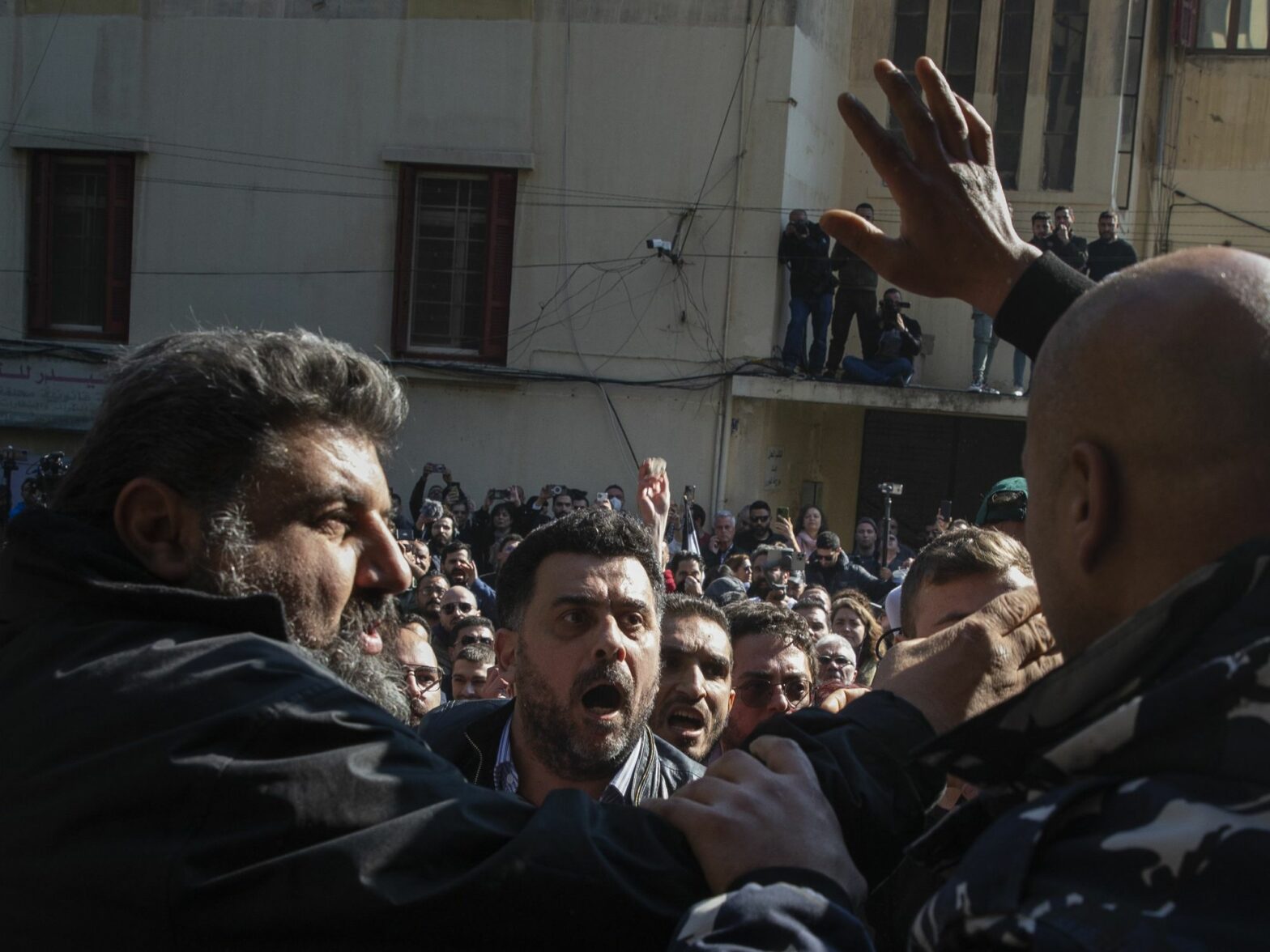 Photo of protesters during a rally organized by family members of victims killed in the 2020 blast in Beirut port, in front of the Justice Palace earlier this year.