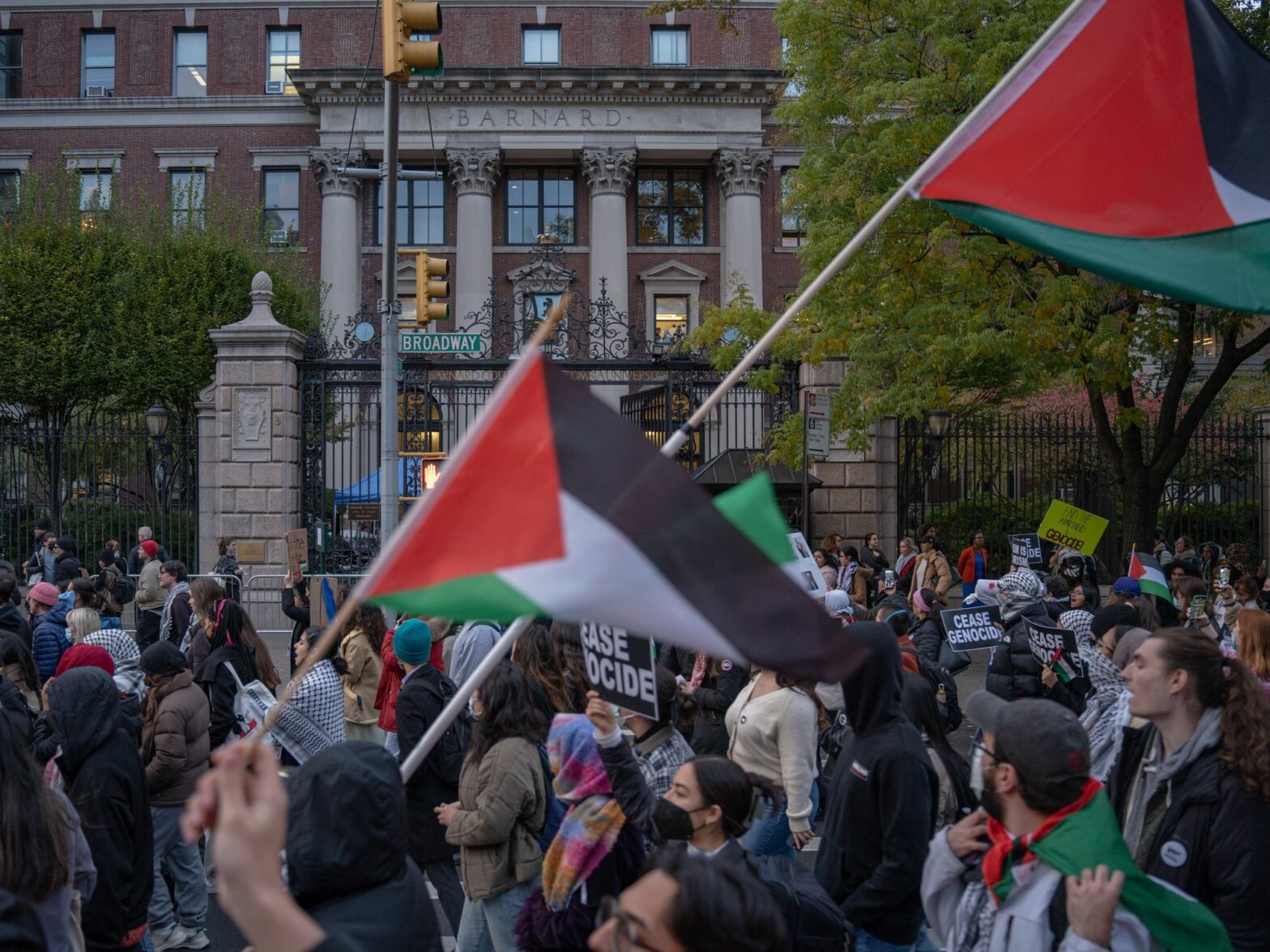 Photo of protesters flying Palestinian flags as part of a pro-Palestinian demonstration near Columbia University in NYC on Nov. 15