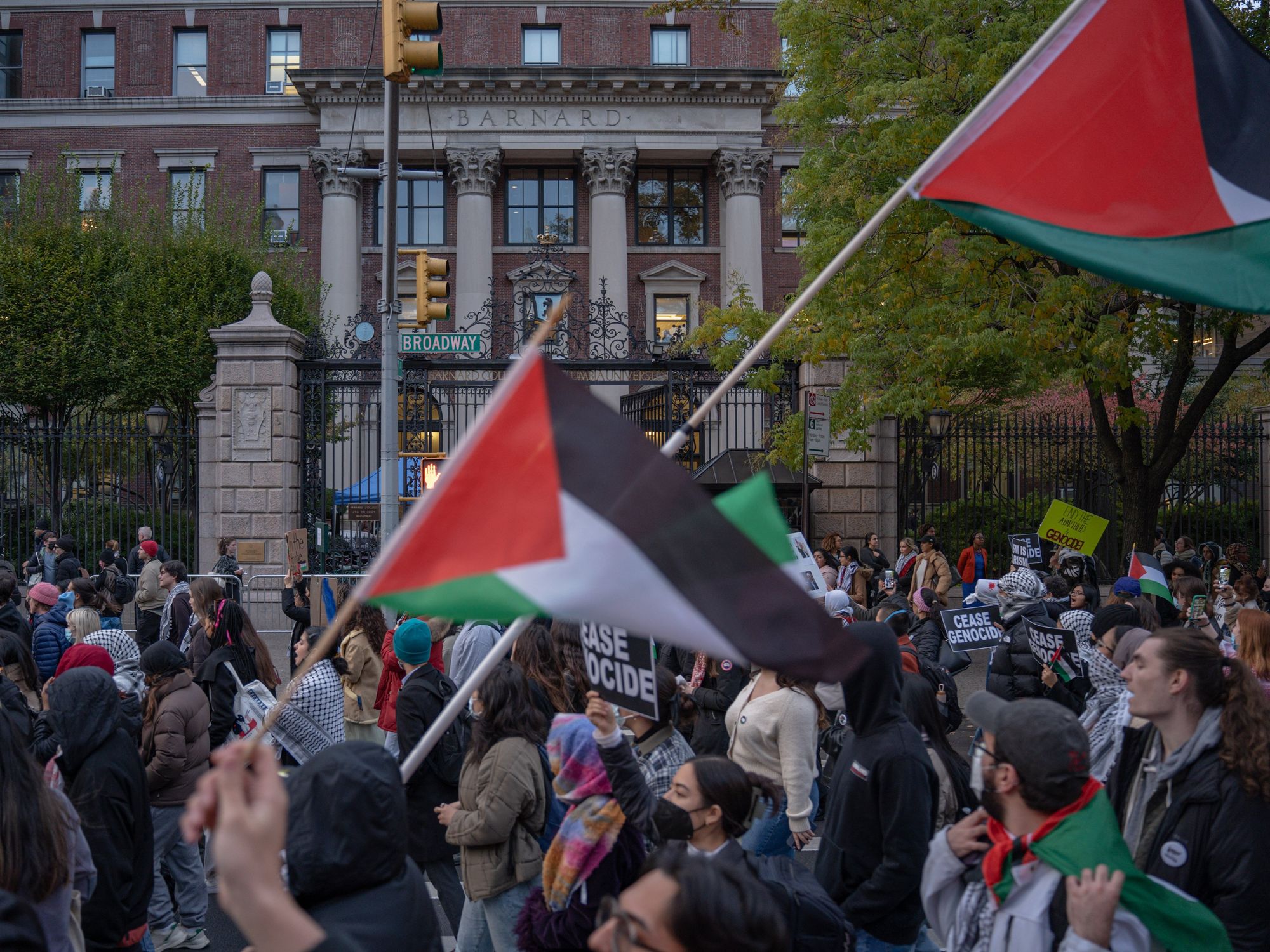 Photo of protesters flying Palestinian flags as part of a pro-Palestinian demonstration near Columbia University in NYC on Nov. 15