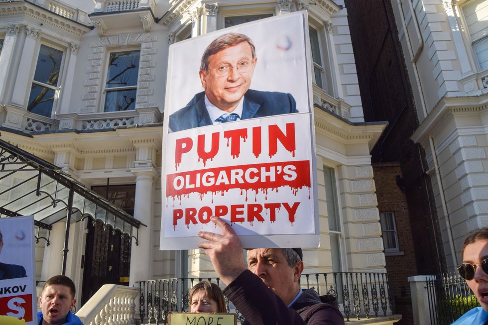 Photo of protestors gathering outside a Russian oligarch's mansion in London